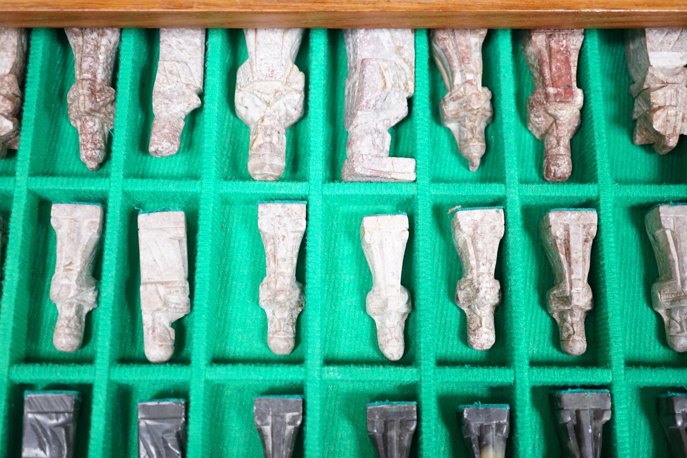 A chess board, with carved soapstone chess pieces